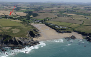 Aerial view of Porthcothan House and Bay.